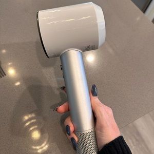 Dyson blow dryer with attachments